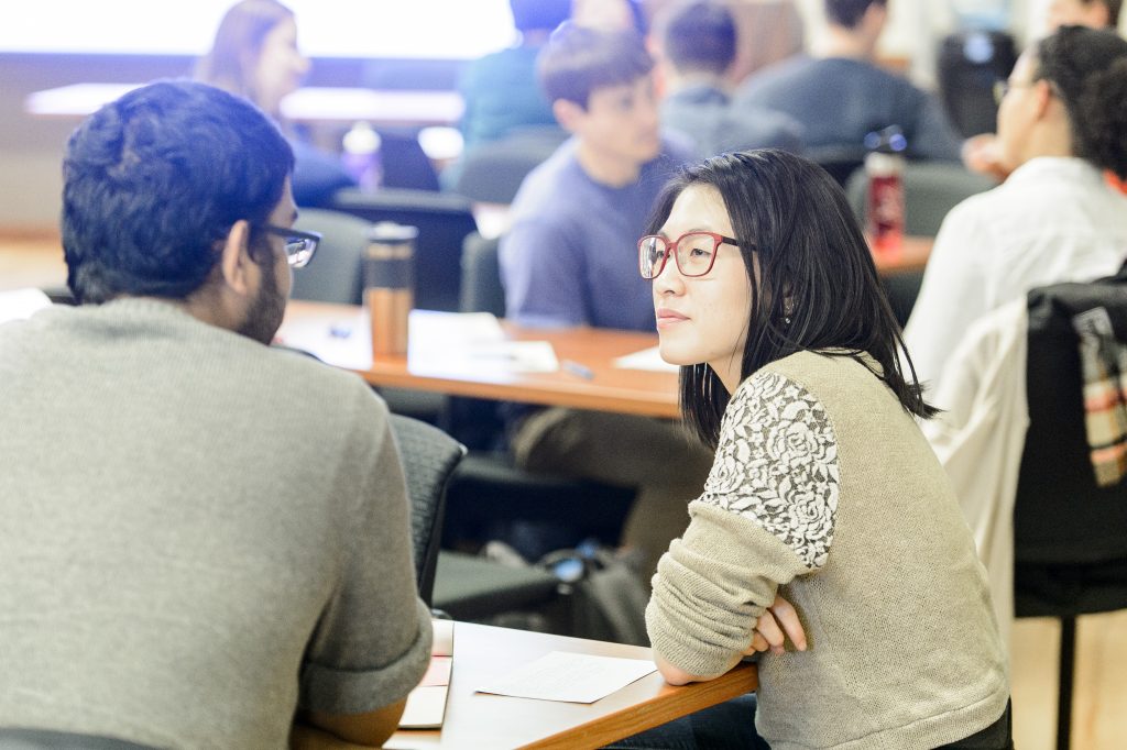 Students talking at a table
