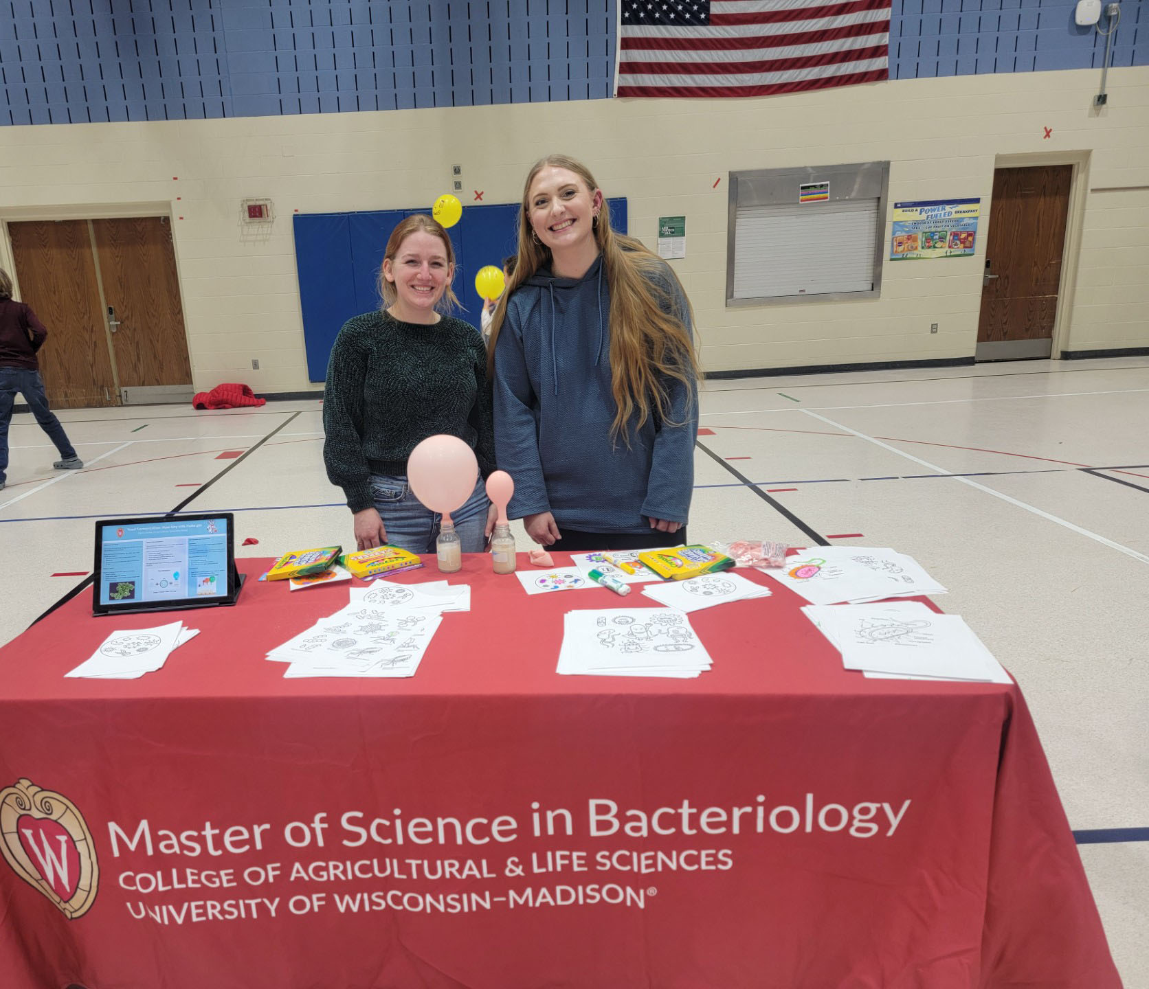 Students at a booth at an elementary school science fair